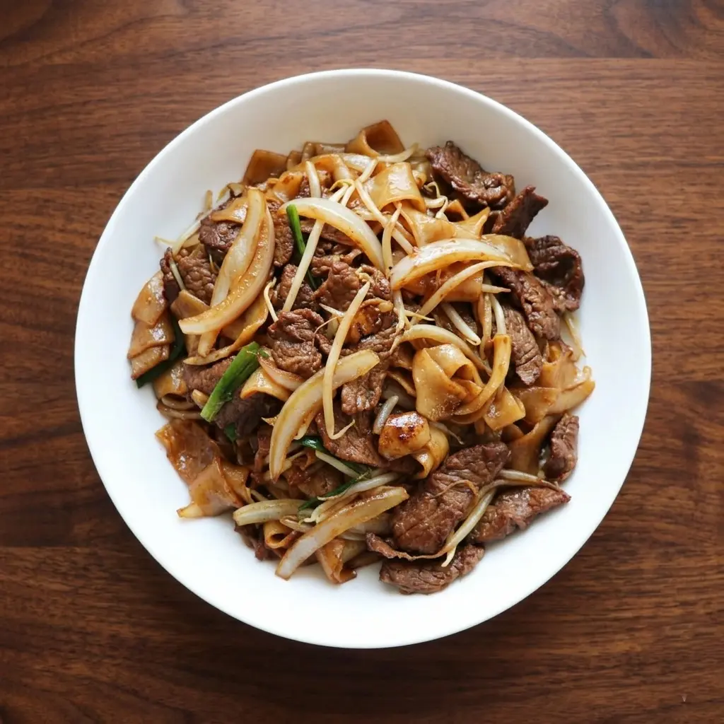 Beef chow fun — wok-fried Cantonese rice noodles at Emerald Garden Calgary